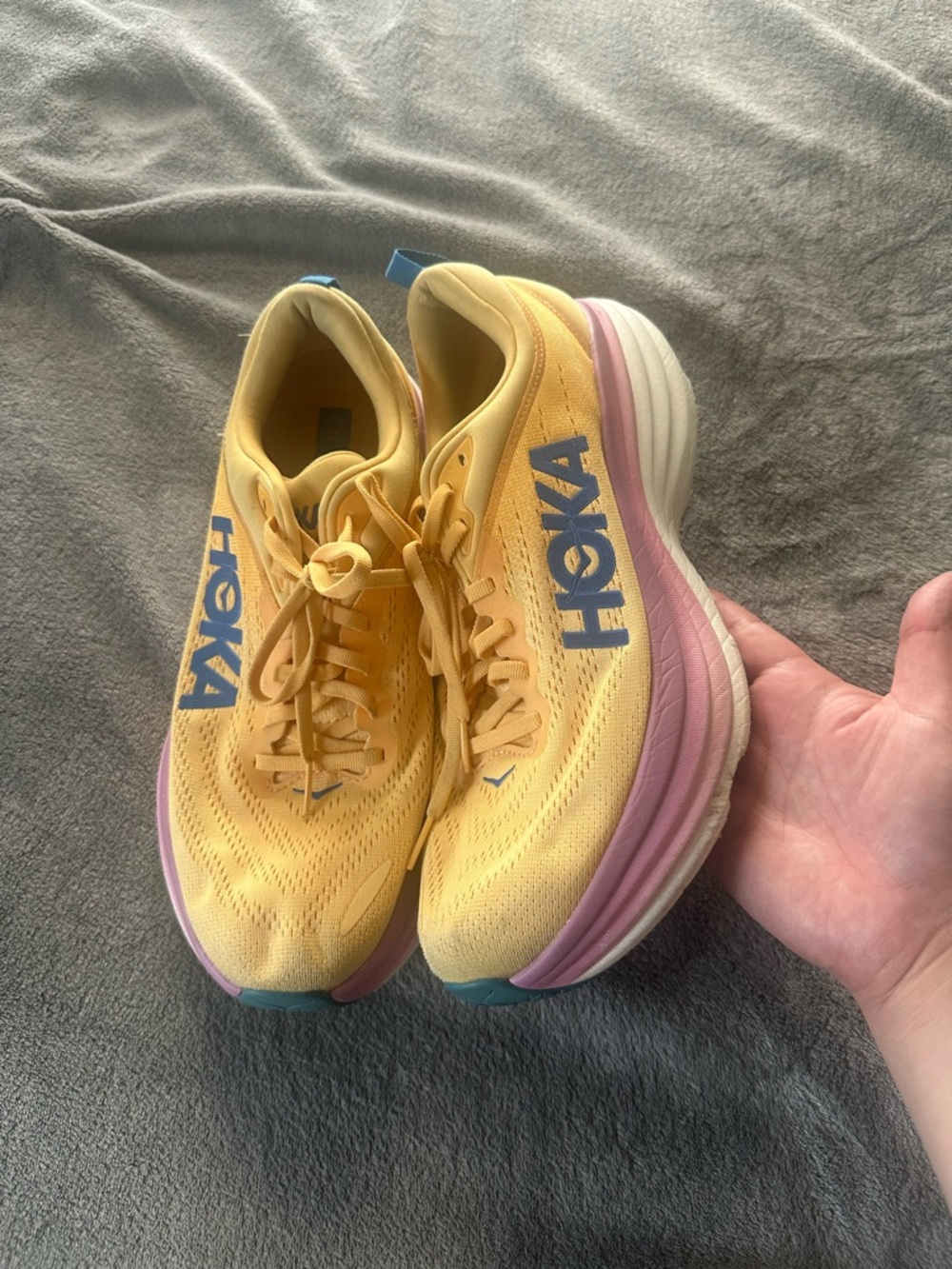 Hoka Yellow Running Shoes with Pink Midsole and Blue Logo